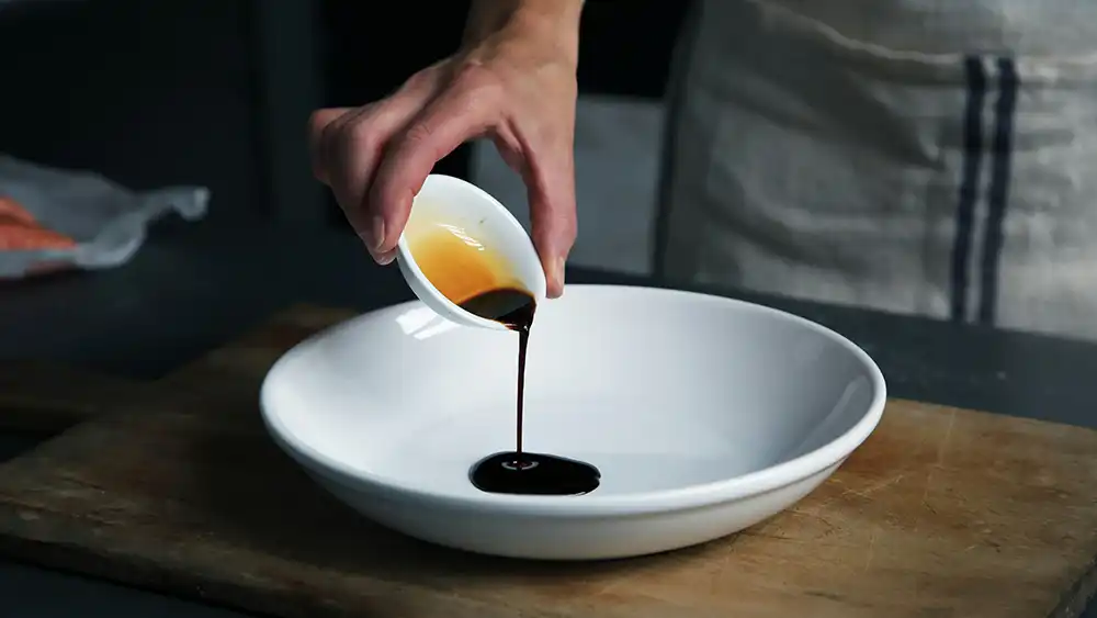 A chef pouring Balsamic